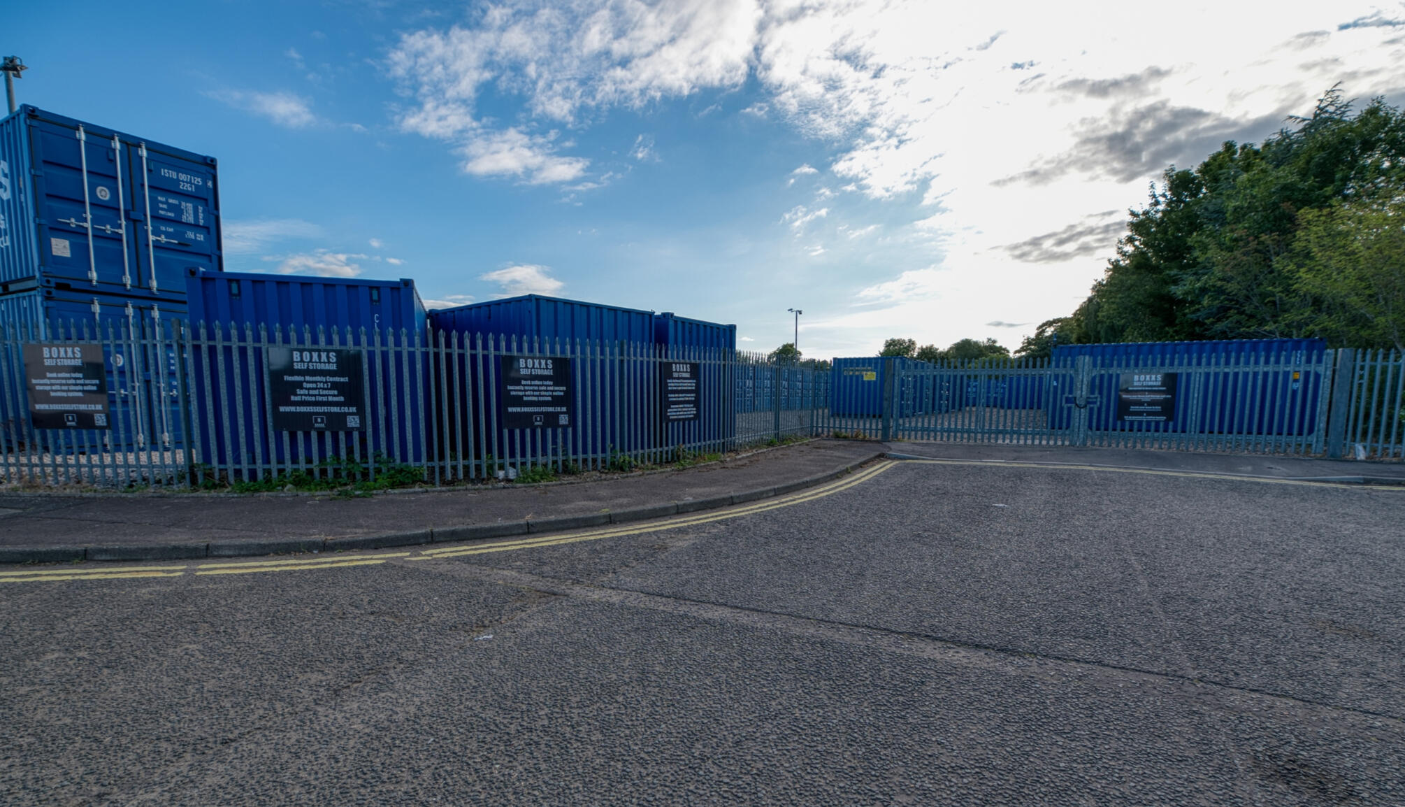 Entrance to Boxxs Self Storage Linlithgow with secure fenced yard Entrance to Boxxs Self Storage in Linlithgow showing containers, secure fenced yard, and gated access for Bo’ness customers